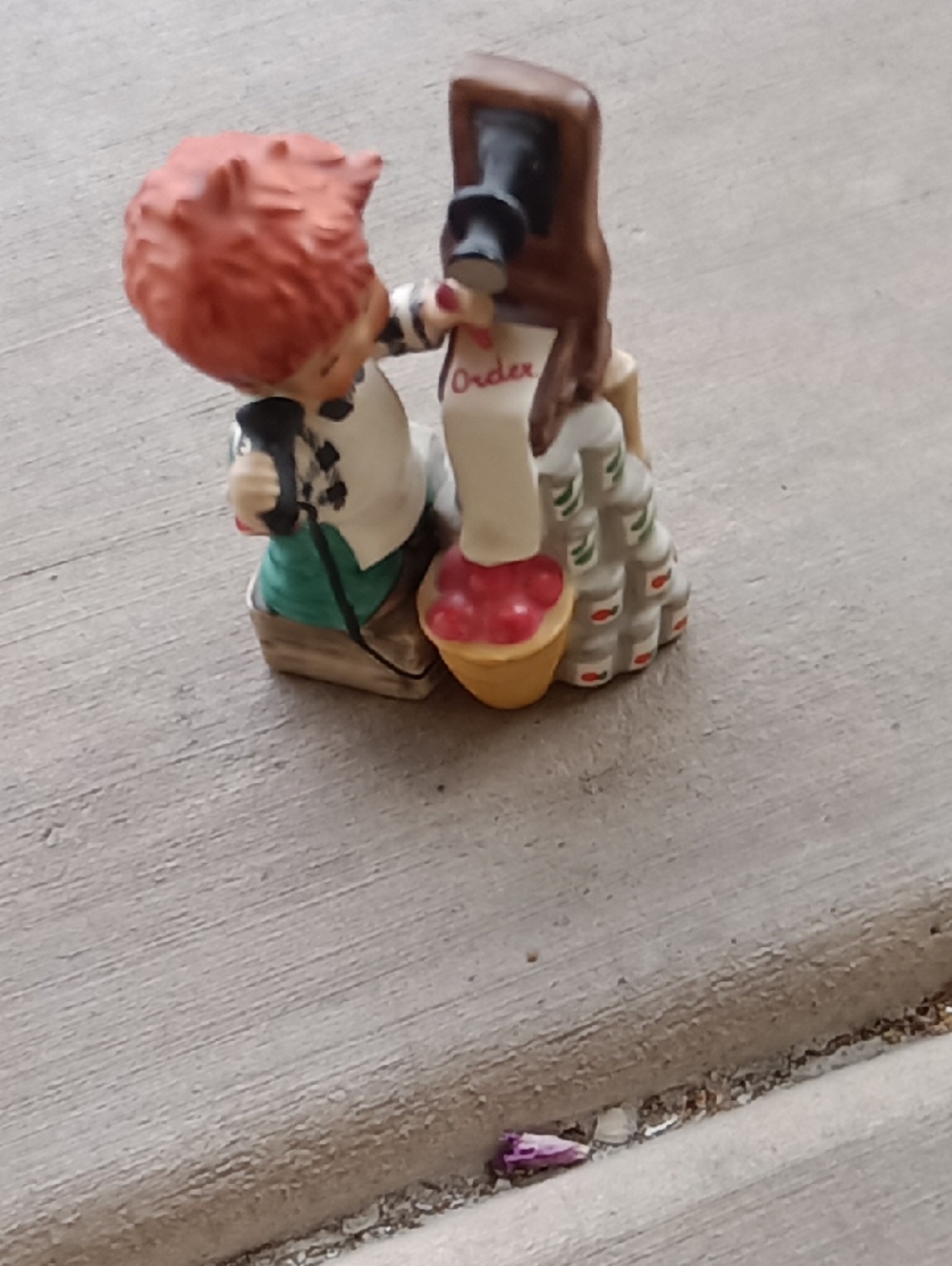 Red-haired Boy Figurine with Fruit Basket
